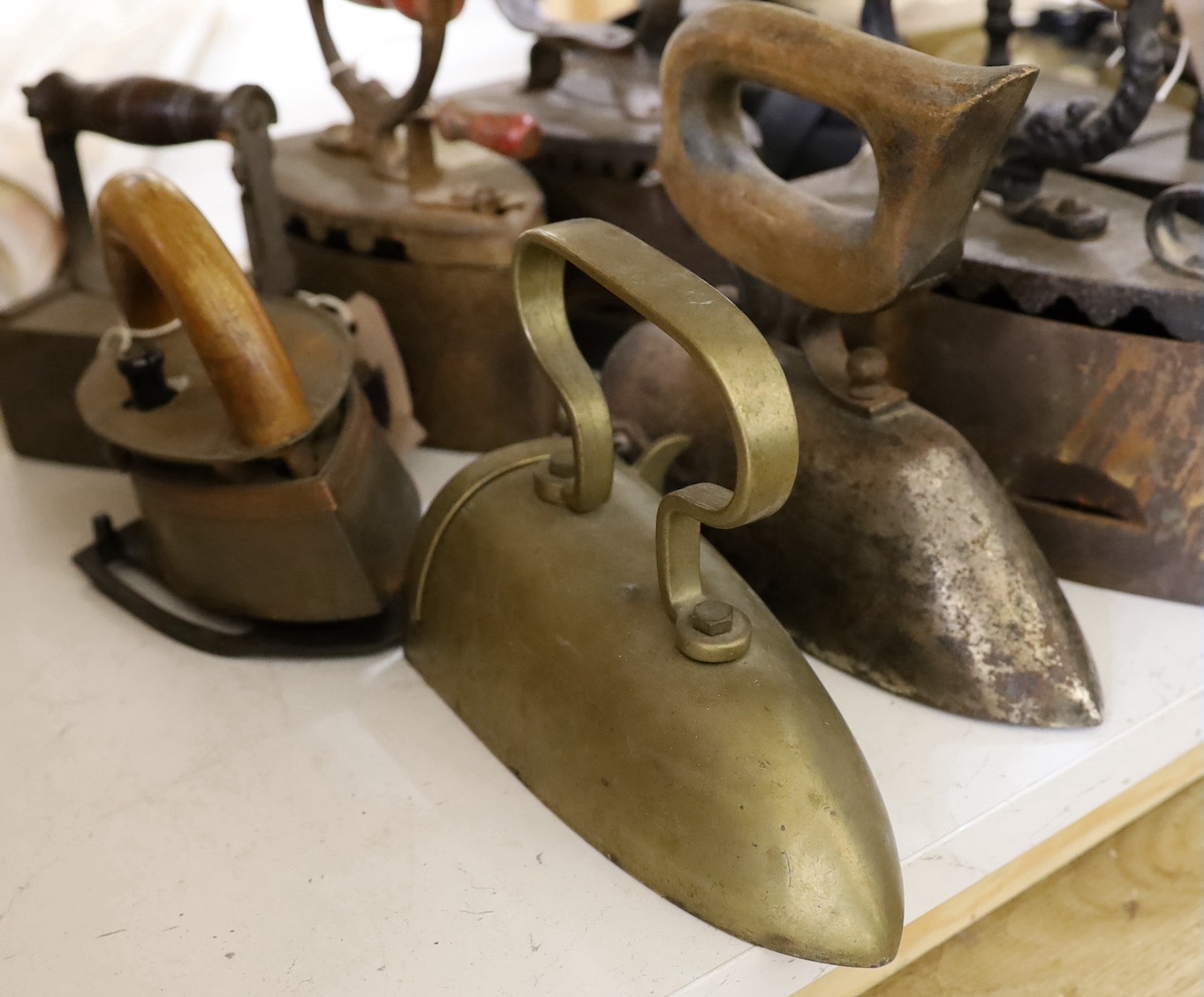Nine various slug irons, tallest 22cm